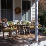 Seasonal Decorations - brown wooden chairs and table near white wooden post