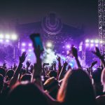 Music Festival - group of people raising there hands in concert