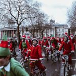 Seasonal Parade - group of children in bicycle near white building