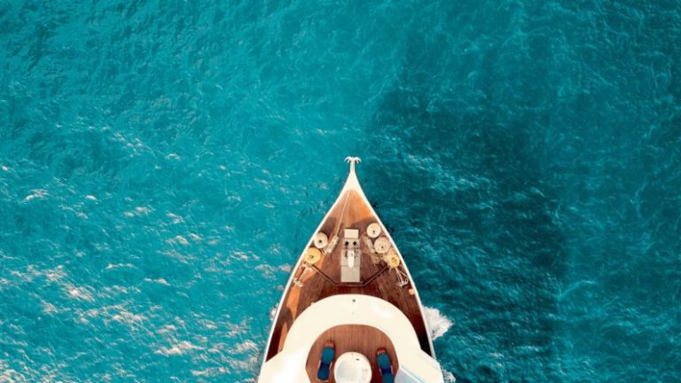 Luxury B&B - birds eye photography of boat on body of water