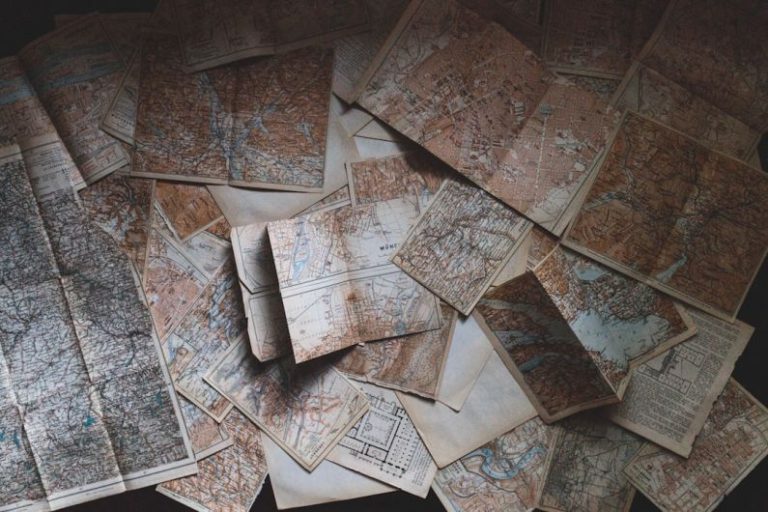 Travel Scams - maps lying on the floor