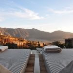 Romantic Luxury B&B - sunloungers fronting buildings near mountain