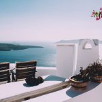 Unique Luxury Features - two brown wooden chairs beside the wall