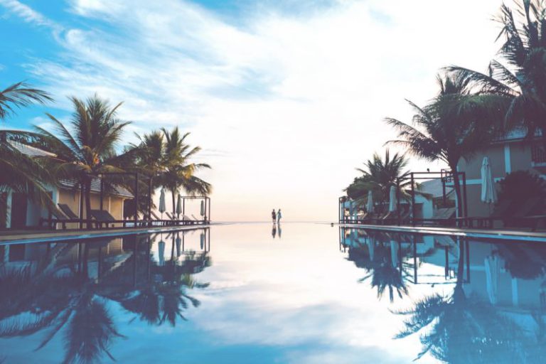 Honeymoon Luxury B&B - two person standing beside swimming pool