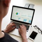 Budget B&B - person using MacBook Pro