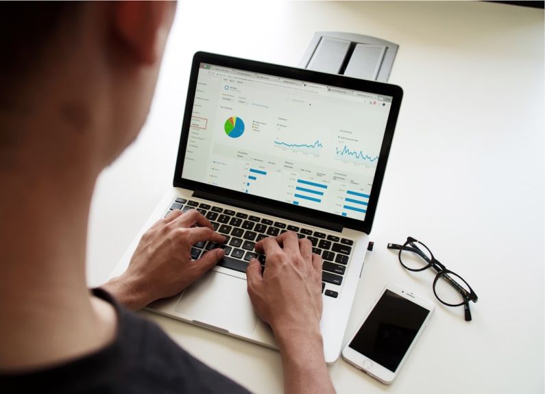 Budget B&B - person using MacBook Pro