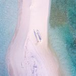 Luxury On Budget - aerial photography of couple standing between body of water