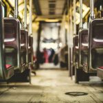 Public Transportation - selective focus photo of vehicle passenger seat