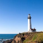California Coastline - a lighthouse on a hill by the water