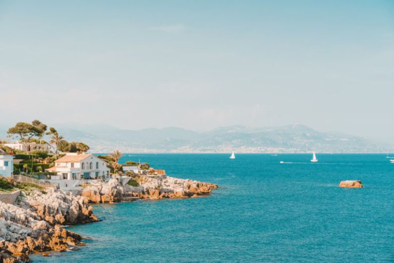 South Of France - white and brown rock formation on sea under blue sky during daytime