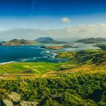 Irish Landscape - green grass field near body of water during daytime