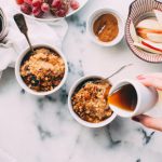 Seaside Bed And Breakfast - person holding white ceramic cup