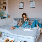 Family At Bed And Breakfast - man and woman lying on bed
