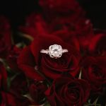 Proposal At Bed And Breakfast - silver-colored ring on top of red roses