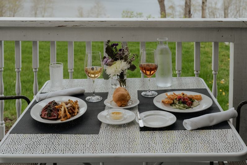 Gourmet Meal - a table that has plates of food on it