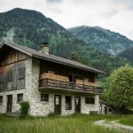 Nature Bed And Breakfast - brown wooden house on green grass field near green mountain during daytime