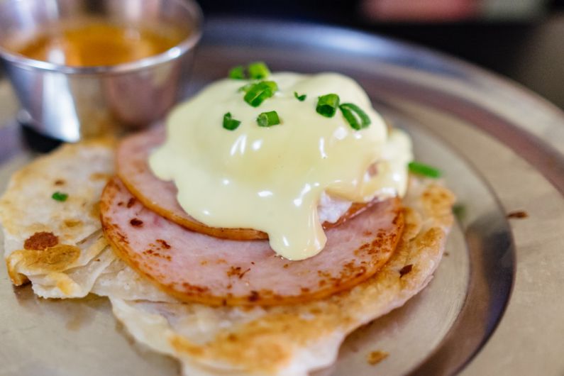 Eggs Benedict - melted cheese on top of cooked ham