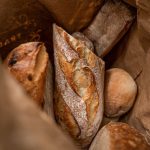 Fresh Bread - brown bread on brown paper bag