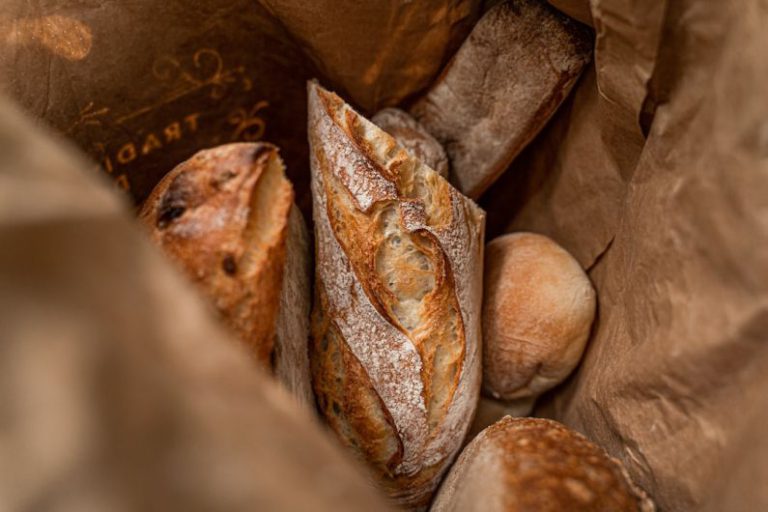 Fresh Bread - brown bread on brown paper bag