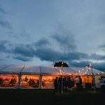Repeat Guests - landscape photography of white canopy tent