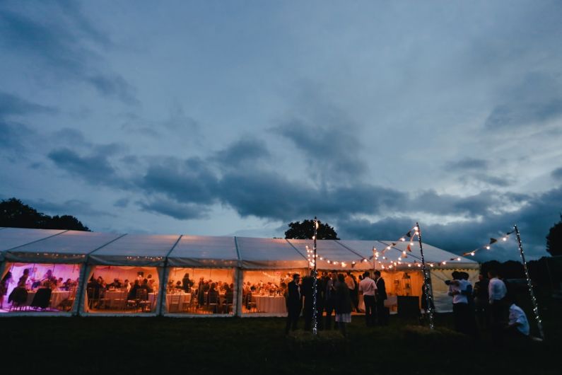 Repeat Guests - landscape photography of white canopy tent