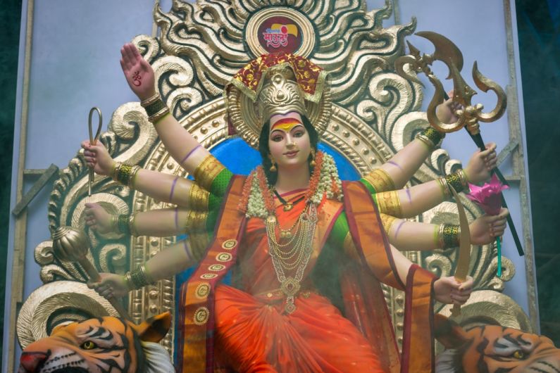 Local Culture Integration - woman in red and gold dress statue